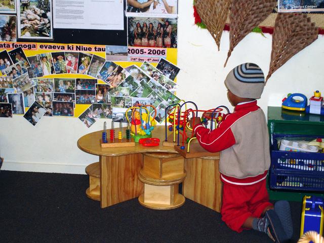 Child playing with toys on a table