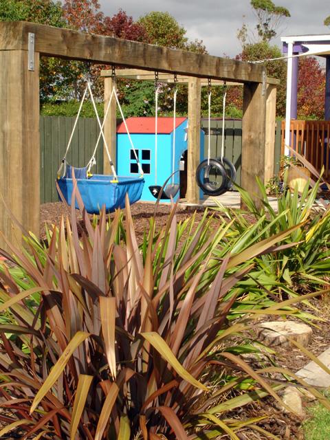 Garden with swings and playhouse