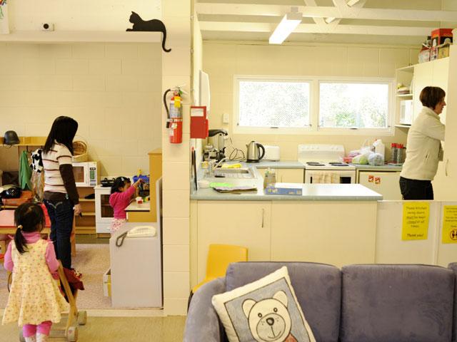 Kitchen in centre visible but inaccessible to children