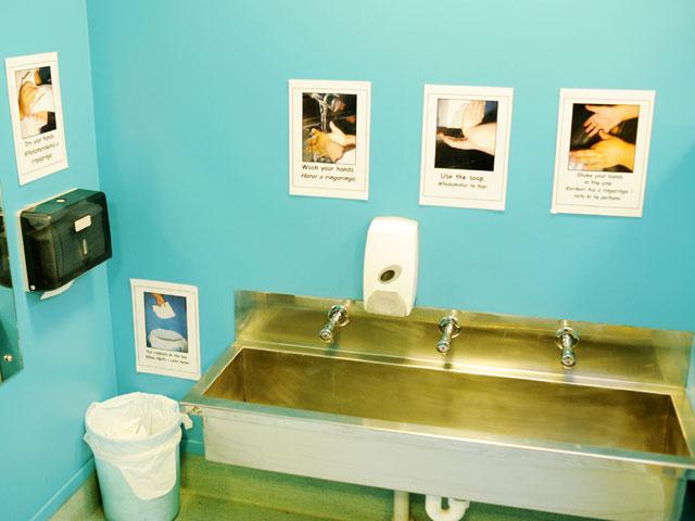 Sink with handwashing instruction posters