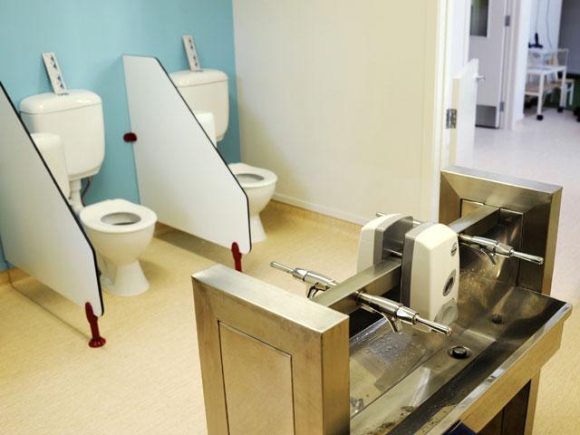 Trough sink with lever taps in bathroom