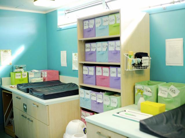 Nappy change facilities with children's individual storage boxes